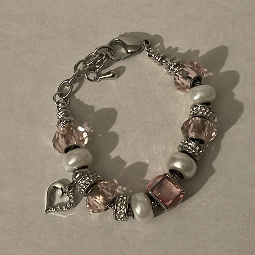 Pink and silver bracelet with heart charm